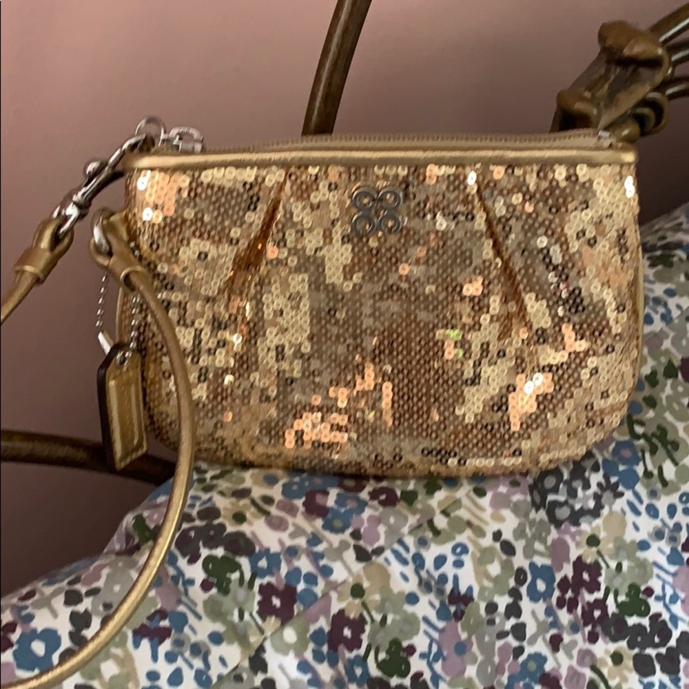 Coach sequin wristlet gold